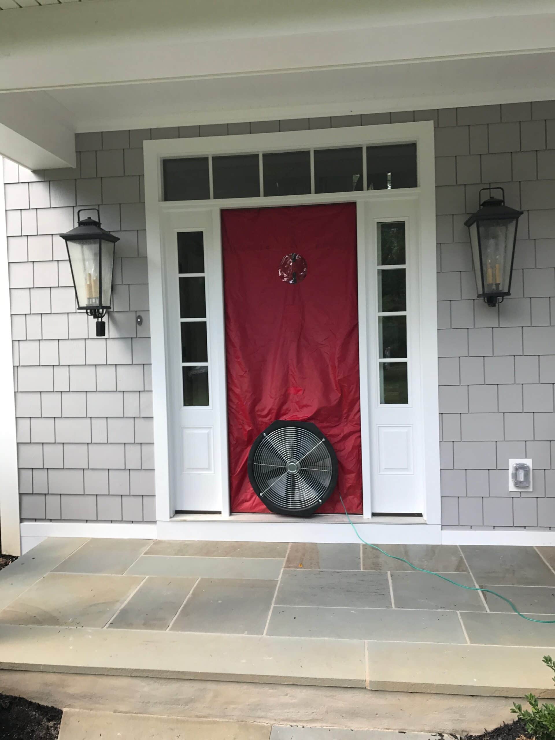 Blower door outside energy audit.