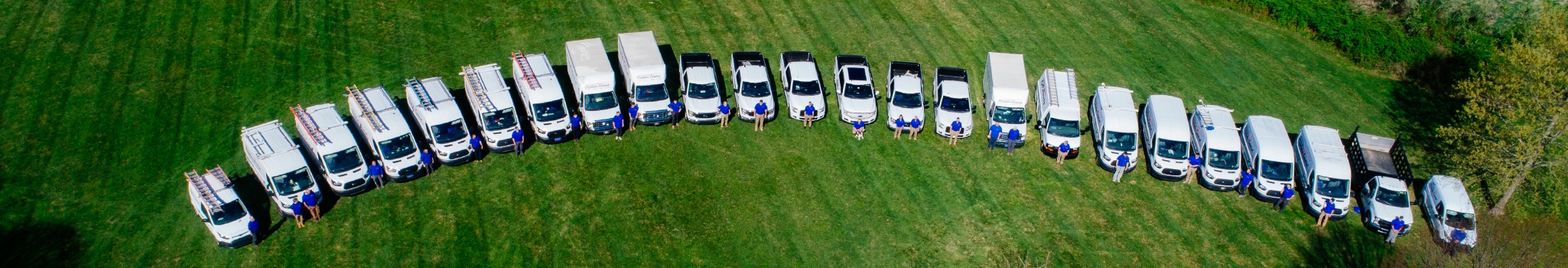 Chadd's Ford service trucks lined up, pictured from above.