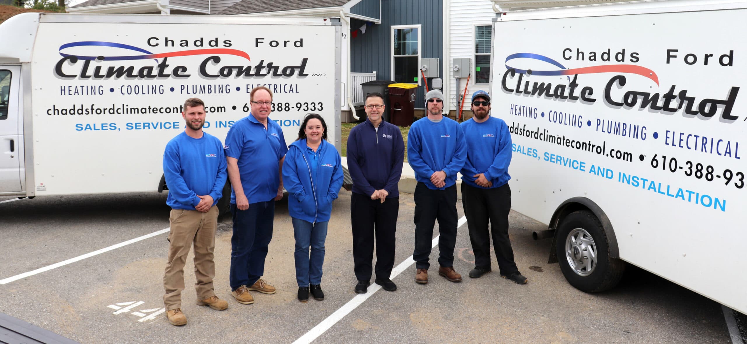 Chadds Ford Climate Control team standing in front of trucks.